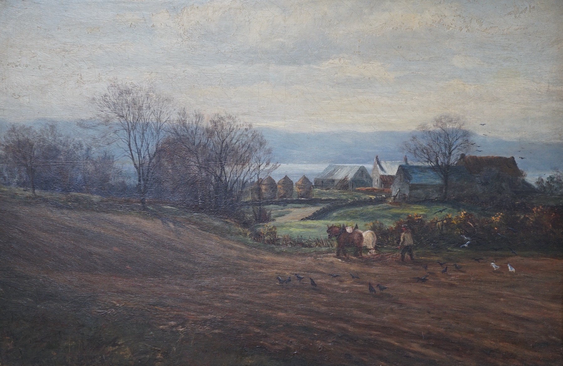 English School, oil on board, Ploughman in a landscape, indistinctly signed, 29 x 44cm